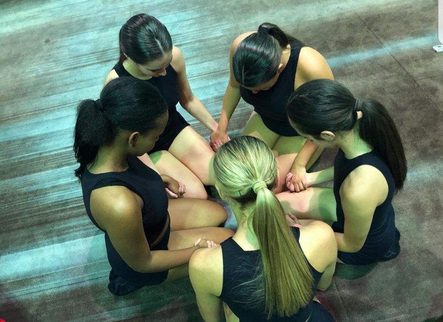 TOGETHER. Before a performance at officer camp, the Sweetheart officers take a moment together.  The officers spent their first week of summer working hard at camp and planning the next year together. It is a tough week that brings the girls closer. 