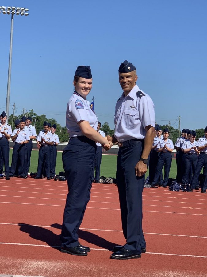 DEDICATION.+Junior+Olivia+Bell+is+honored+as+a+Distinguished+Graduate+while+at+CLC+leadership+camp+this+summer.+Bell+was+one+of+ten+AFJROTC+members+to+attend+the+camp+hosted+by+the+US+Navy.+