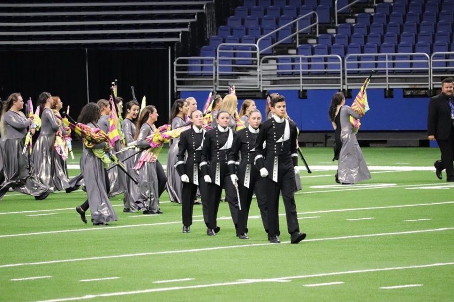 The drum majors take the field at the 5A State Marching Competition in San Antonio. The band finished 26th in the state with their show Expanding Spaces. 