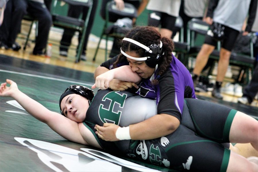 PIN IT TO WIN IT. In a rematch against a tough Huntsville opponent, freshman Yabi Paulino attempts a pin. 