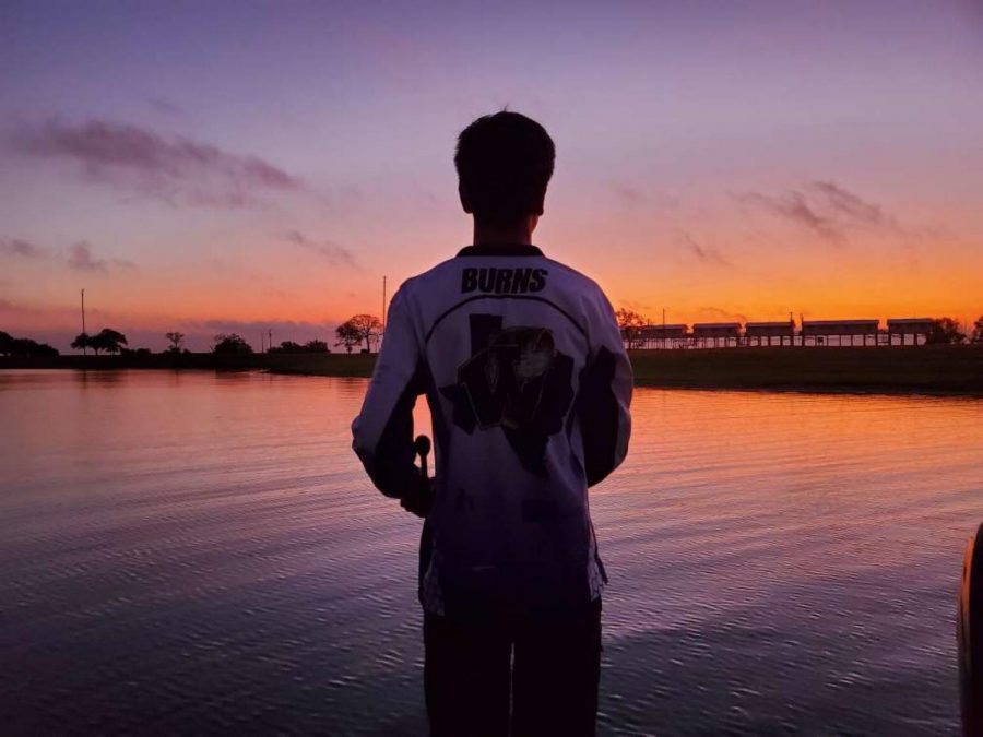 THE BEAUTY OF NATURE. During a fishing tournament, sophomore Logan Burns tries to catch a big one. The team fishes on Lake Conroe and lakes all over the state. 