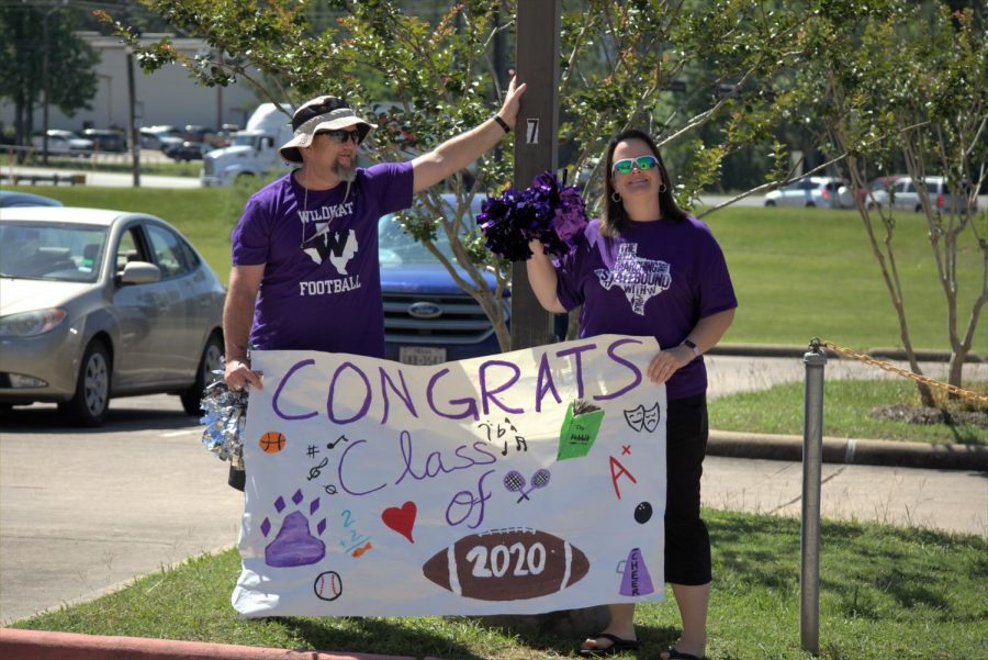 Wresting coach Bryan Thomas and English teacher Bridget Thomas cheer the senior on. Faculty members surprised seniors by celebrating the class of 2020 when they came to pick up their yard signs.  The event was meaningful to the teachers and students since the ending of the school robbed them the chance for traditional good-byes. 