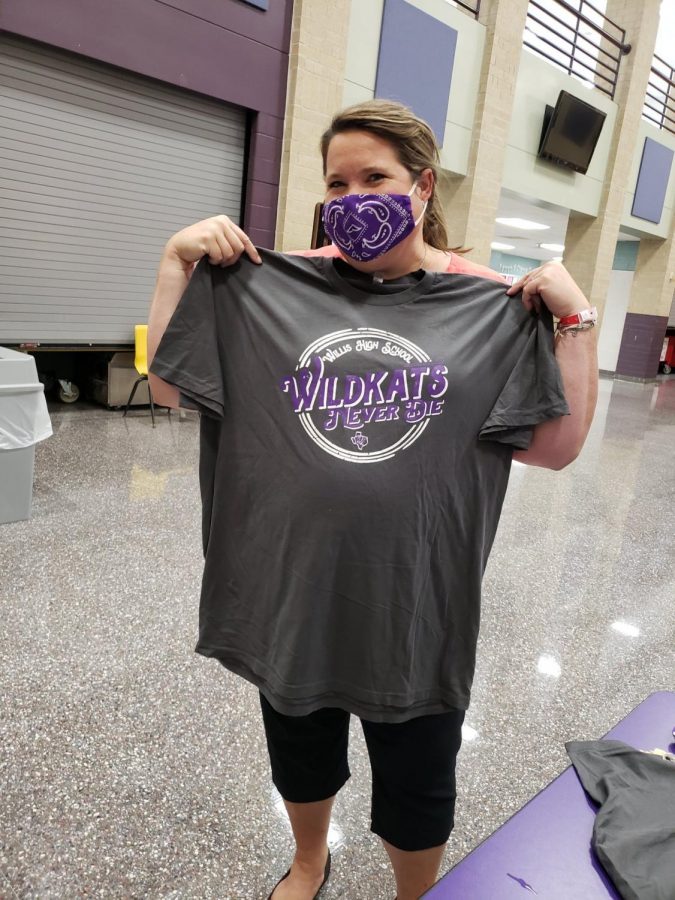 SUPPORTING THE SENIORS. Showing off her new WIldkats Never Die shirt, counselor Karol Smith supports the class of 2021. As part of a fundraiser, teachers and staff members can buy a jeans day on Wednesday for the entire year if they also buy an OpGrad shirt. 