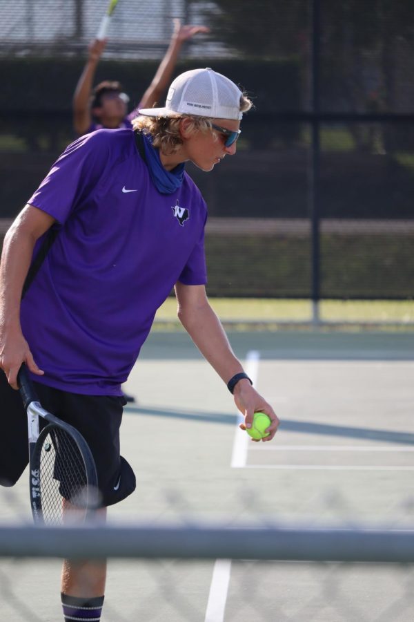 SERVE+IT.+SMASH+IT.+WIN+IT.+In+a+district+match+against+College+Park+on+Tuesday%2C+sophomore+Blaine+Eckert+prepares+to+serve.+The+tennis+team+plays+Huntsville+on+Friday+at+home.+