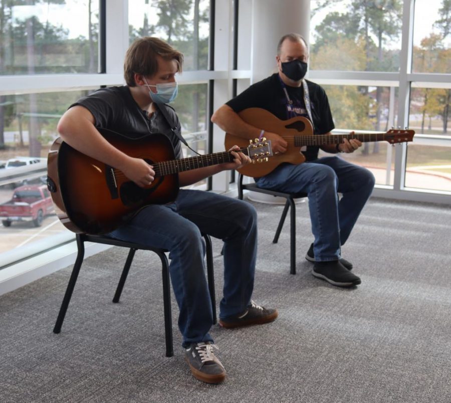 PRACTICE MAKES PERFECT.  Preparing for Willis Unlpugged on December 10, junior Douglas Fairbanks and director Ken Labonski practice upstairs in the PAC.  Choir and guitar have in-person concerts scheduled in December. 