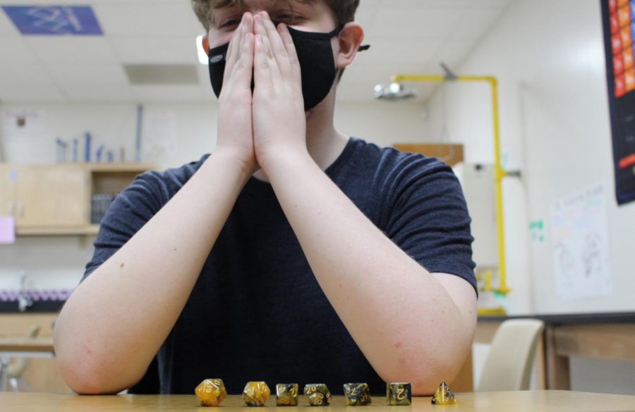 With his dice lined up, freshman Zander Beetge is prepared for the game ahead. Science teacher started the Dungeons and Dice club for students interested in table top clubs like Dungeons and Dragons. 