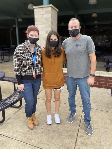 GROUP CELEBRATION. Senior Julianna Needham stands with directors Laurelyn Korfhage and Ken Labsonski during the class celebration for Needham. Needham is the third student to make it into All State choir from Willis High School. 