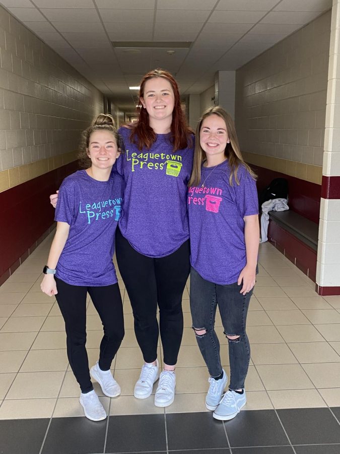 STATE CHAMP. WIth their Leaguetown Press shirts on, juniors Stephanie Keele, Summer Rains and Heather Jackson take a picture at Cy Woods High School, a hub for the state academic UIL meet. Jackson won the 6A state championship in news writing.  Leaguetown is the fictional high school that serves as the setting for all UIL journalism stories. 