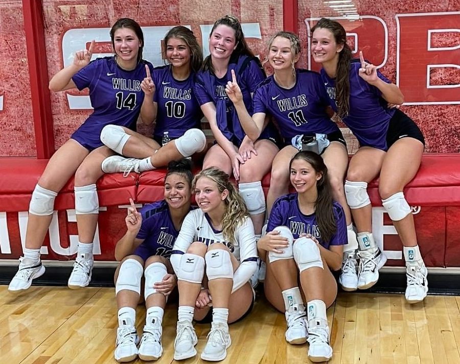 CELEBRATION TIME. After a great night for Wildkat volleyball, members of the varsity team celebrate their victory over Splendora. 