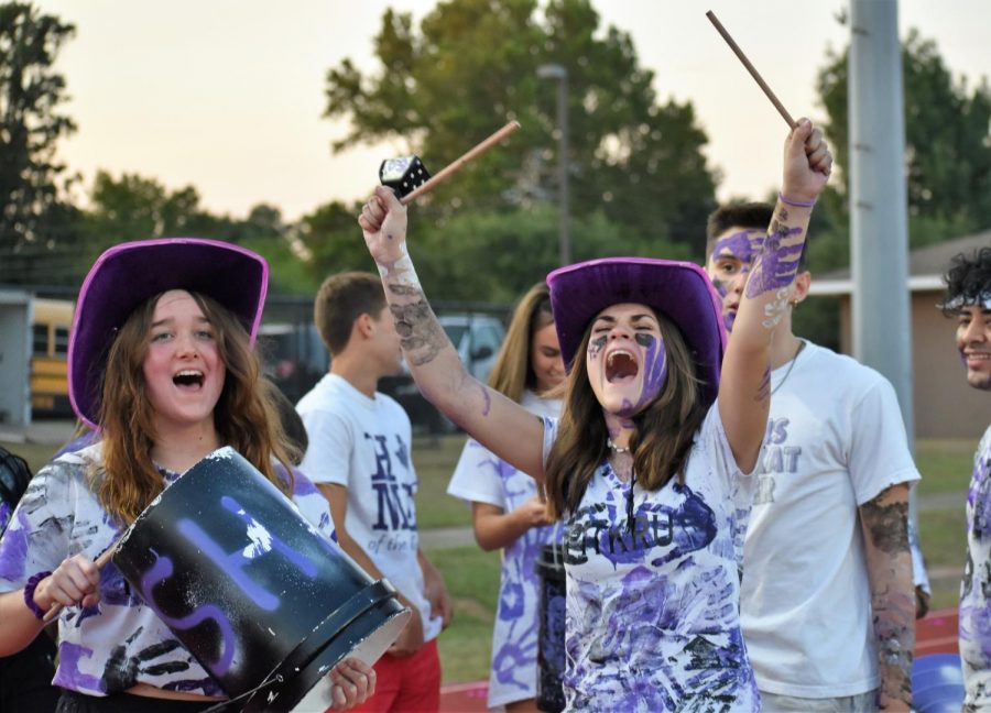 WILDKATS NEVER DIE. At the game against Houston Bellaire, seniors Paige Greeney and Jennifer Talley yell with the PitKru. The PitKru is an organization on campus that boost spirit at football games. 