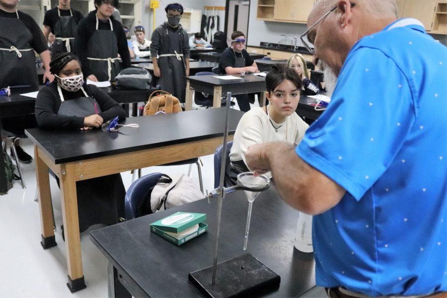 WATCH AND LEARN. In Gary Grangers AP Chemistry class, junior Jasmine Rodriguez gets the best view of the demonstration of the lab on conservation of mass. The hands-on aspect of science classes breaks the monotony of the day when students get to learn by doing. 
