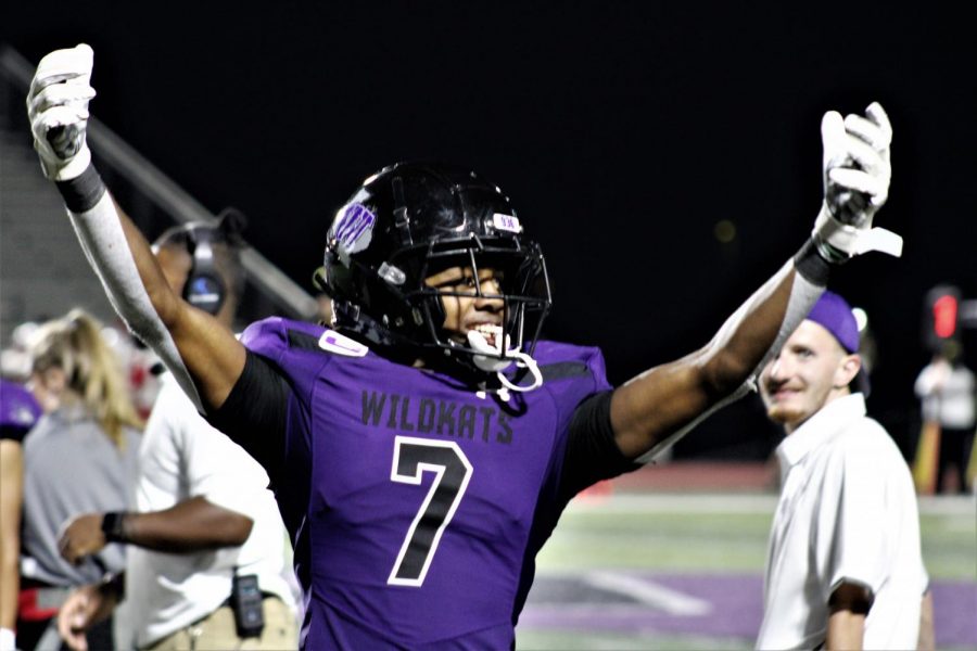 SHARING+HIS+CELEBRATION.+After+scoring+against+Houston+Bellaire%2C+senior+Jadarius+Brown+celebrated+with+the+crowd.+The+50-27+win+for+the+WIldkats+was+the+first+for+the+season.+