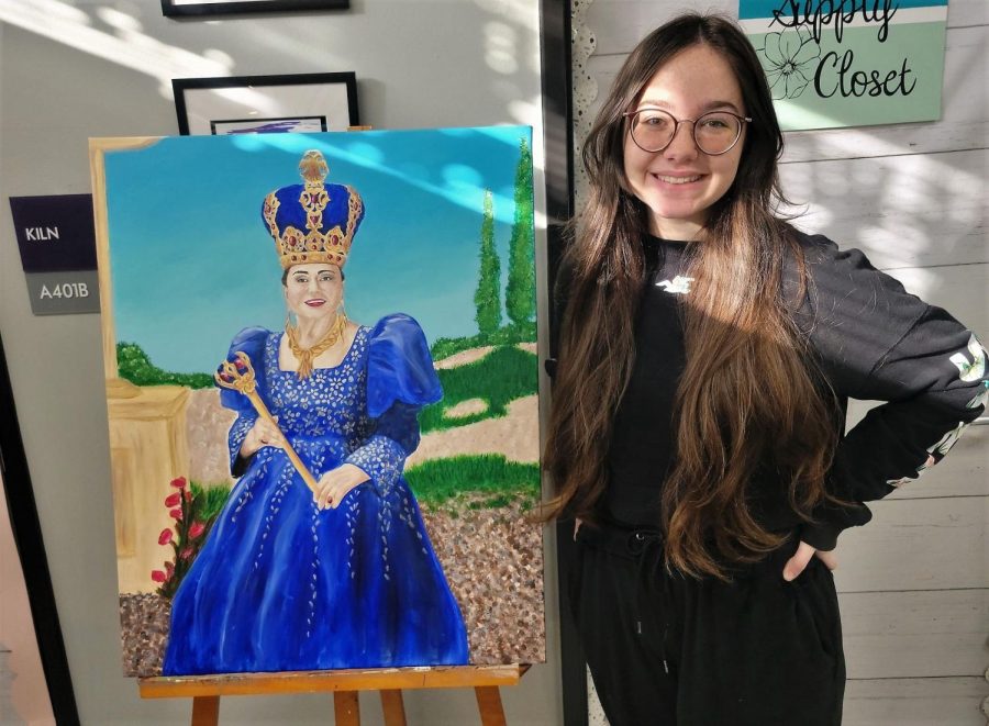 HUZZAH. Junior Nicole Hathaway show off her picture of the Queen of RenFest.  She was commissioned to paint the portrait. 