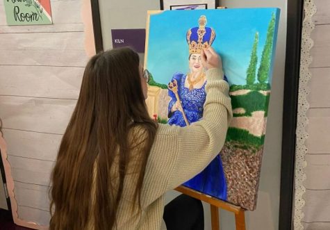 VIBRANT COLORS. Putting the finishing touches on the crown, Hathaway is almost done with her artwork.