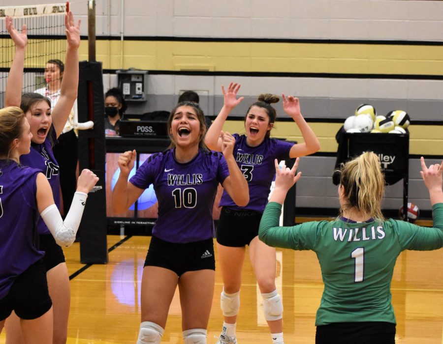 THRILL OF THE KILL. In a tough game against the Conroe Lady Tigers, junior Savannah Paske celebrates with the team. The Lady Kats went 5 sets in the tough district loss. 