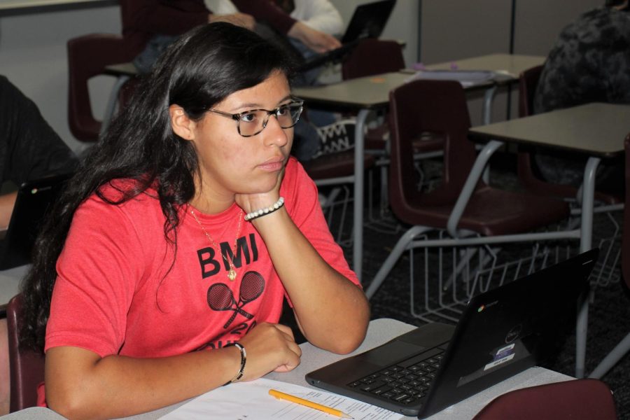 READY IN RED. Dressed in red to kick off the week sophomore Carol Perez works in class on her Chromebook. Red Ribbon Week started off with the school wearing red in honor of Special Agent Enrique Camarena of the U.S. Drug Enforcement Administration who was killed in duty.
