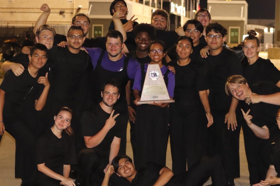 CELEBRATION TIME. Senior drum major Luna Cortez hold the award for months of hard work surrounded by her fellow seniors after winning Sweepstakes at UIL competition. 