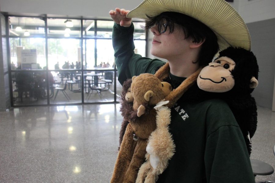 MONKEYING AROUND. Spending safari day surrounded by primates, junior Jacob Downs hangs out with his animal friends at lunch. 