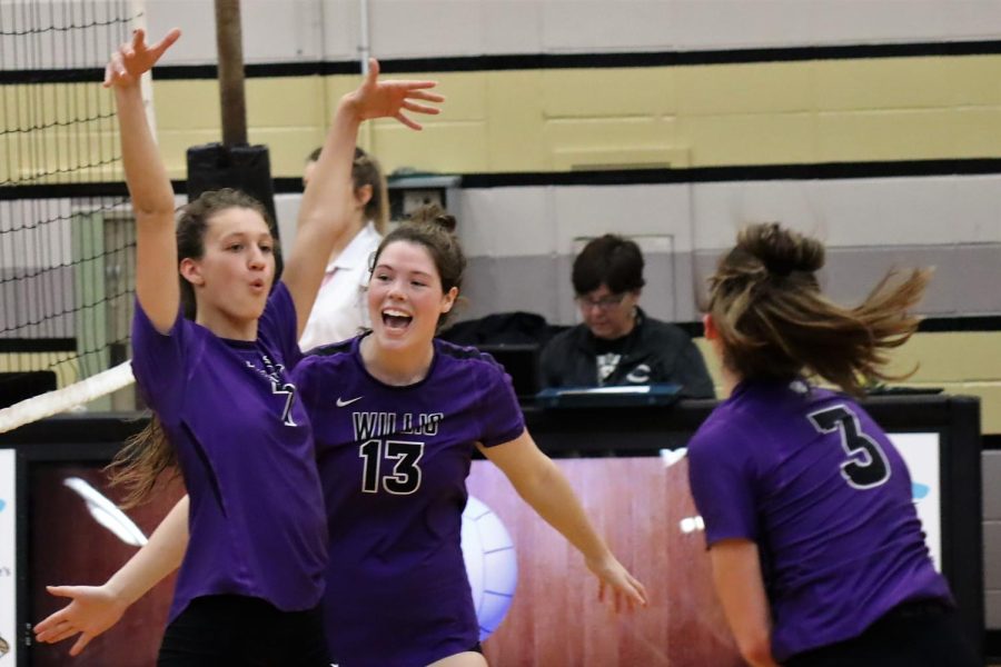 THAT A GIRL. At the game against Conroe, senior Georgia Everett congratulates senior Rylee McDonald after a great play. The team fought hard and lost in five sets to the district rival. 