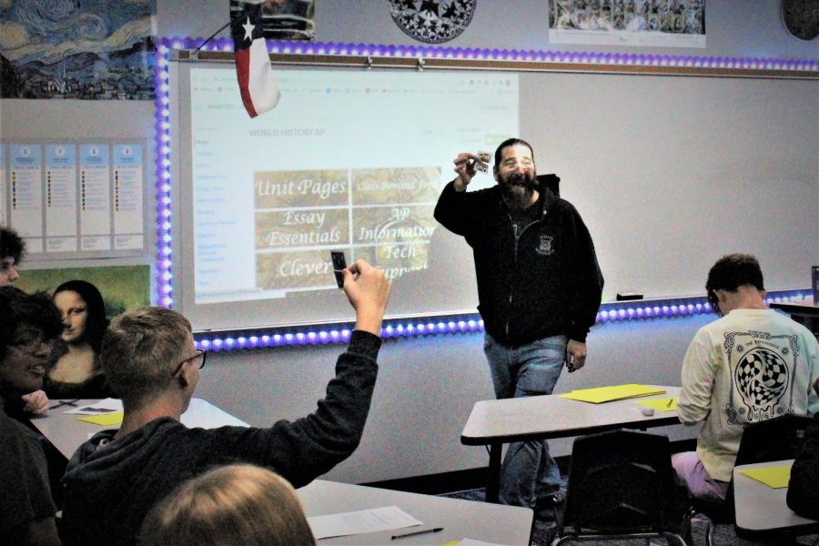 NO MAGIC NEEDED. Teaching his class how to be successful in his class with a cards, AP World History teacher Michael Robinson shows his card to the class. For many of the students, this is the start of college level classes in their high school career. 