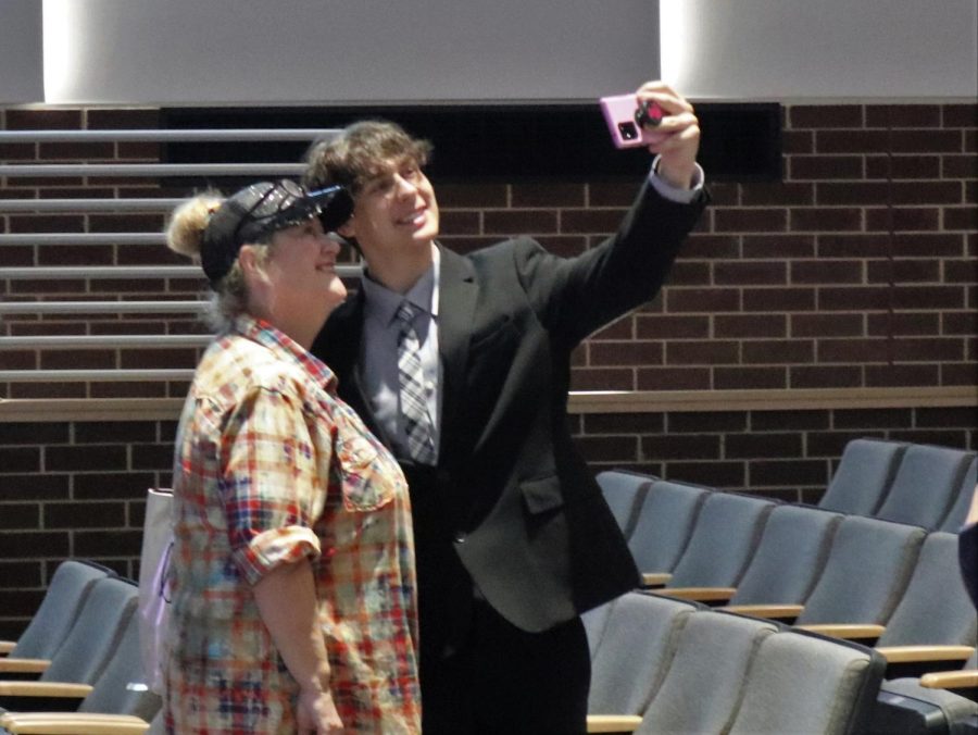 PROUD MOMMA. Taking a picture with his mother Kim Scholwinski, junior Michael Scholwinski smiles for a selfie for his moms Facebook. 