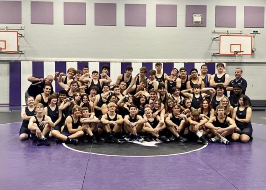 REFUSE TO LOSE. Member of the wrestling team kid around after their team picture. The team has grown under the direction of Coaches Bryan Thomas and Brian Blake.