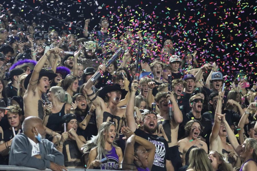 I BELIEVE THAT WE WILL WIN. The student section explodes with spirit at the homecoming game. 