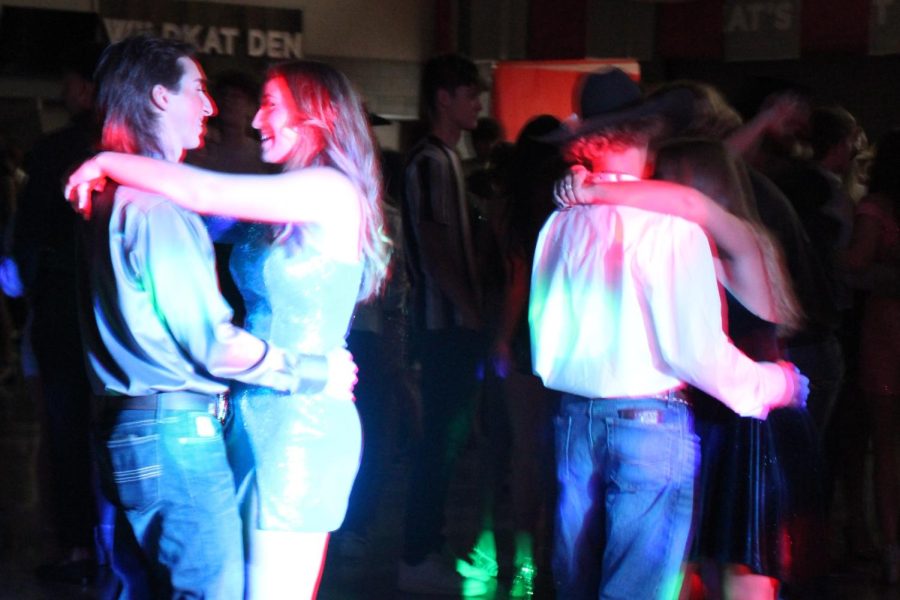 DANCING THE NIGHT AWAY. Enjoying a slow song during the dance, students spend time at the Greatest Show on Turf.