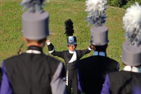 SMALL BUT MIGHTY. Leading the band in a warm up, senior drum major Luna Cortez directs at area competition at Galena Park.