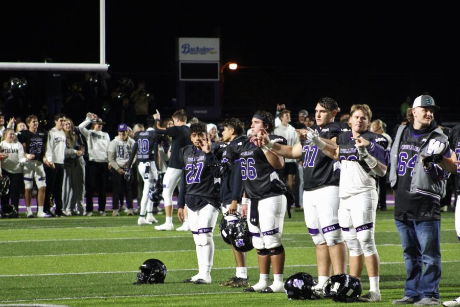 YOURE GONNA MISS THIS. A group of senior football players link pinkies for the school song as a large group of seniors gather in the end zone for the senior walk after the Conroe game. Photo by Cooper York