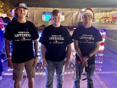 LUTTRELL FOR CONGRESS. At the Magnolia Christmas Parade, junior Blaine Eckert, freshman Lawson McCaskill and senior Brenan Mansker volunteer for the Morgan Luttrell campaign. Luttrell, a Willis alumni, is running for U.S. Congress. 