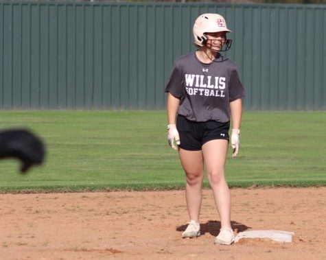 READY TO PLAY. Waiting on 2nd base, junior Hannah Hartman plays in a fun Christmas-themed scrimmage combining the baseball and softball teams. The softball team starts the 2022 season off Saturday with a scrimmage in Waller. 