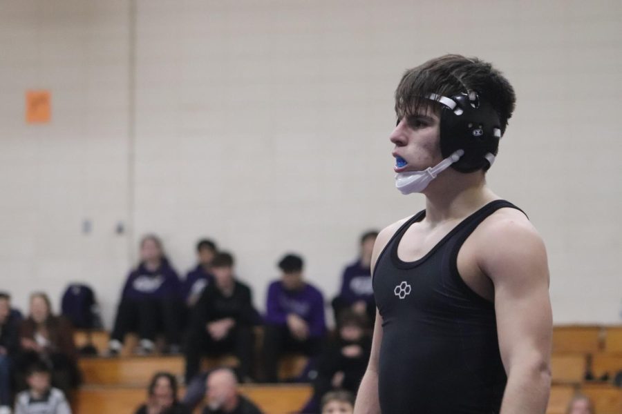 READY FOR VICTORY. Heading to the mat, sophomore Ethan Elliott prepares for the competition ahead. The only home meet of the season was Wednesday at Lynn Lucas Middle School gym.