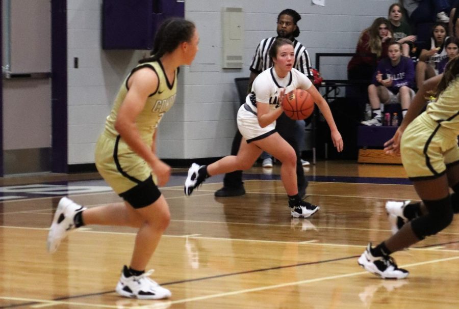 RUN THE BALL. During the game against the Conroe Tigers, junior Lucy Smith takes the ball back to the Wildkat side of the court. 