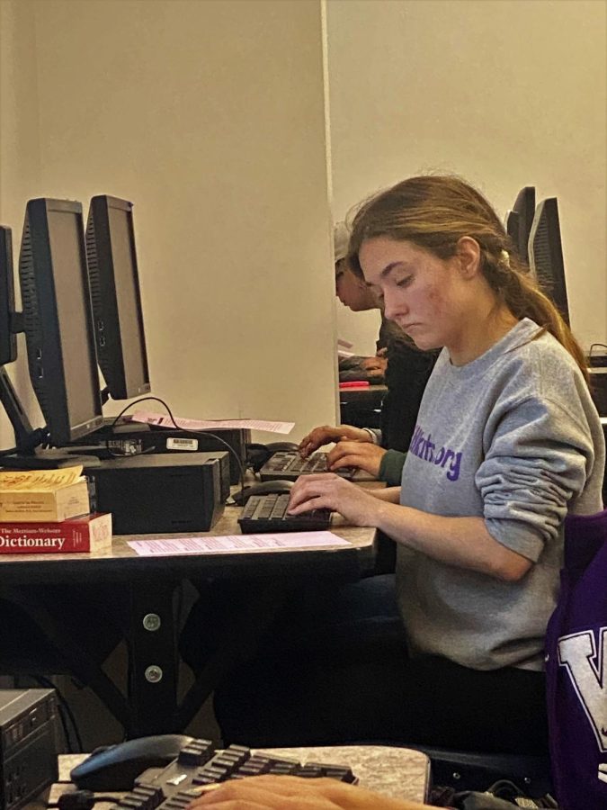 GIVING IT ALL SHES GOT. In her third of five events, senior Stephanie Keele works on her feature story at the contest. She also competed in copy editing, editorial writing, news writing and headline writing at the meet. 