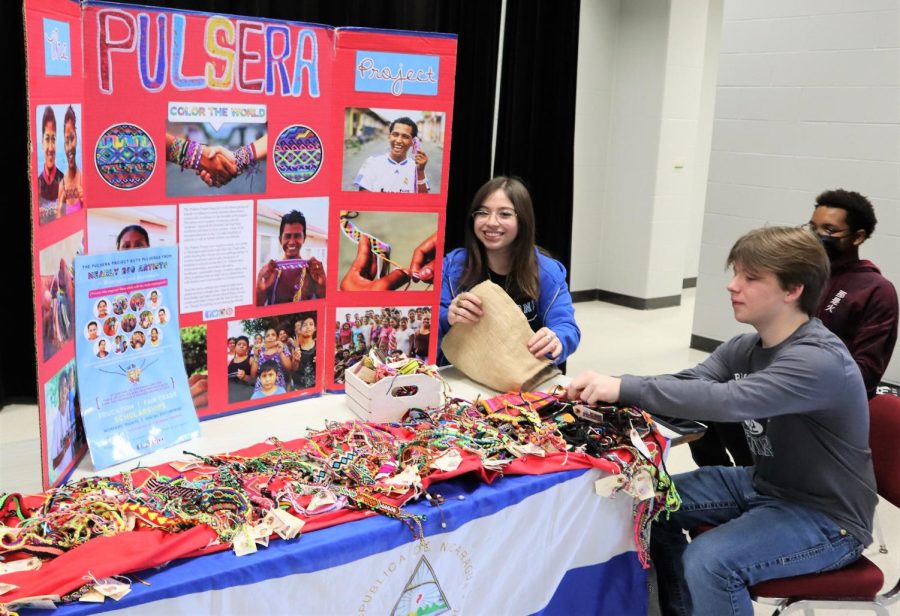 HELPING OTHERS. Members of Spanish NHS sell pulseras during lunch on Feb. 9. The club will continue to sell until Feb 17th with proceeds going back to the artisans who made the bracelets. 