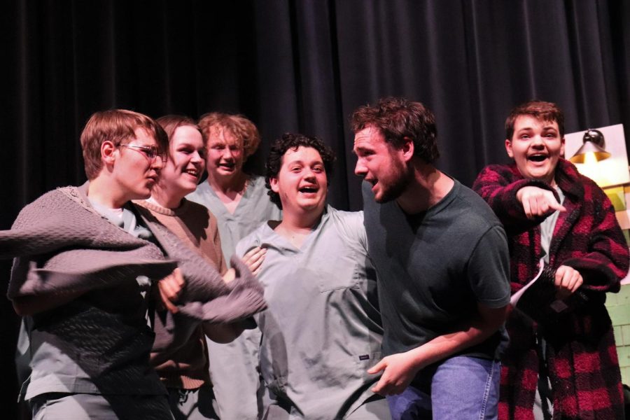 READY FOR A PARTY. Playing the part of McMurphy, senior Josh Brookshire hypes up the guys for a party he is planning. Brookshire was named best actor at the district competition.