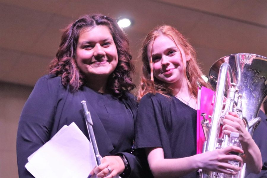 HARD TO SAY GOODBYE.  At their last concert together, junior Sophia Cruz and senior Faith Miner memorialize the moment with a picture. The last concert means a lot to the seniors and the friends they are leaving.
