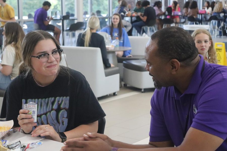 LUNCH-TIME CHAT. During a CTE lunch, new assistant principal Rickie Duncan visits with junior Emily Vaughn.