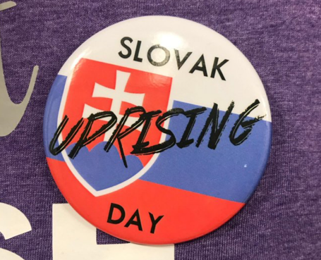 UPRISING REMEMBERED. Buttons commemorating Slovak Uprising Day were distributed by English teacher Chris Slovak.  
