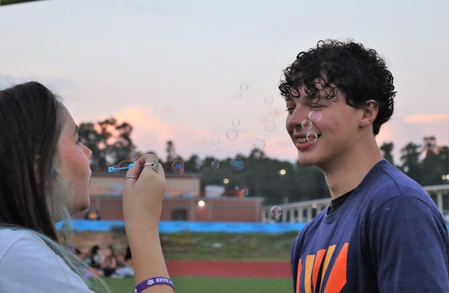 BUBBLE TIME. During the Senior Sunrise, seniors Nicole Hathaway and Cameron Crawford take time for bubbles before class started on Friday.  Bubbles were included in the senior swag bags given to all seniors.  