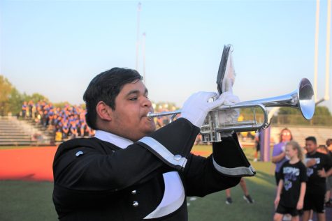 TALENTED LEADERSHIP.  Drum major Tony Silvero plays for a crowd at Berton A Yates Stadium. Band offers opportunities for art with marching performances and concert performances. 