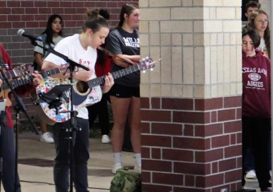 MUSICAL INSPIRATION. Performing at the event, junior Cheyenne Swonke play songs of praise. 