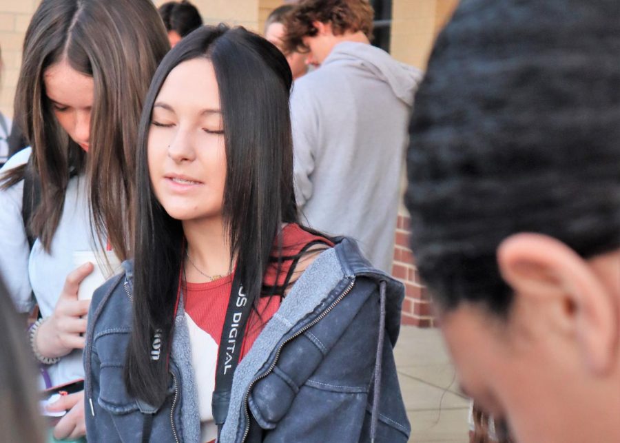 Deep in prayer, senior Laci Dorough spends her time before school at See You at the Pole. The events allows students of all faiths to join as one. 