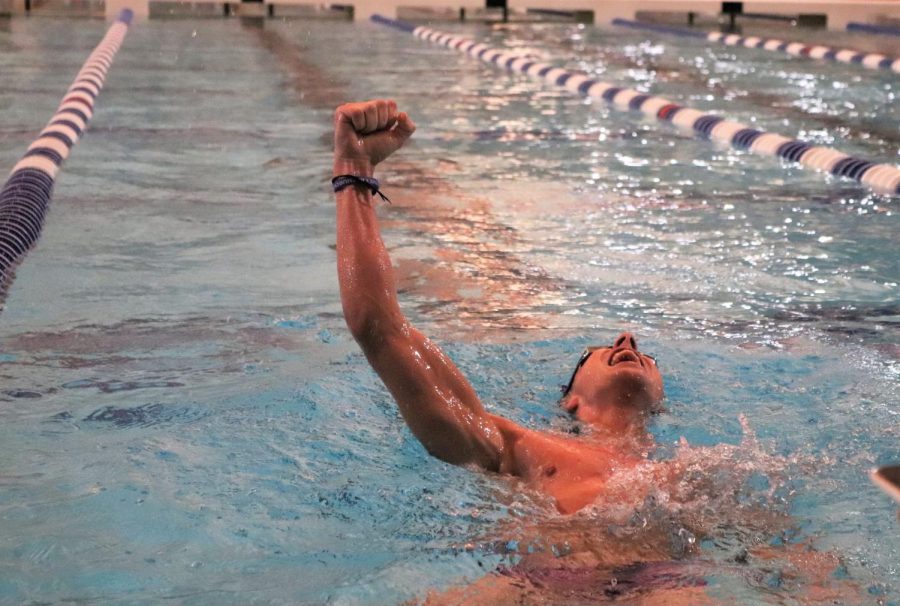After breaking his PR in the 100 breaststroke, junior Keddie Ramsden celebrates his victory. Ramsden won the race with a 1:08:86 time at the meet against Oak Ridge and College Park on Thursday. photo by Blaine Eckert