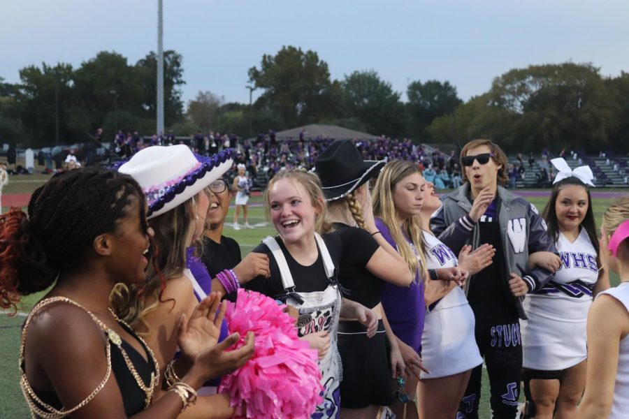 STUDENT COUNCIL SMILES. While welcoming the College Park High Schools student council members before the homecoming game, members of the Wildkat Student Council share a laugh. photo by Brody McNew