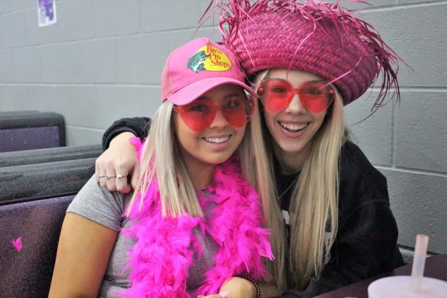 PRETTY IN PINK. On Wednesdays senior Kamryn Willey and Chelsea Forrester wear pink to show their support for the Kats. Each day leading up to homecoming had a theme to boost excitement for the game. 