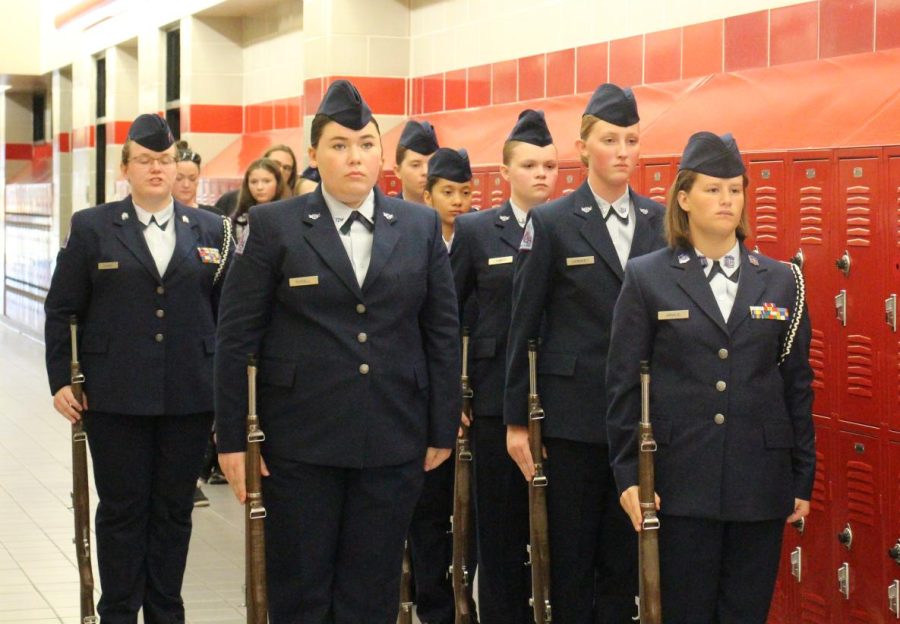 LOOKING SHARP. With their uniforms in perfect order, members of the AFJROTC program prepare to take the floor at competition. The female color guard and the academic team both placed high on the ranks at their first competition at Oak Ridge High School.
