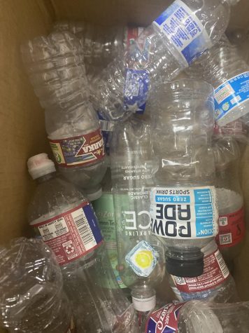 BOX OF BOTTLES. For the recycling drive, boxes are left out that can be filled with plastic bottles and aluminum cans.