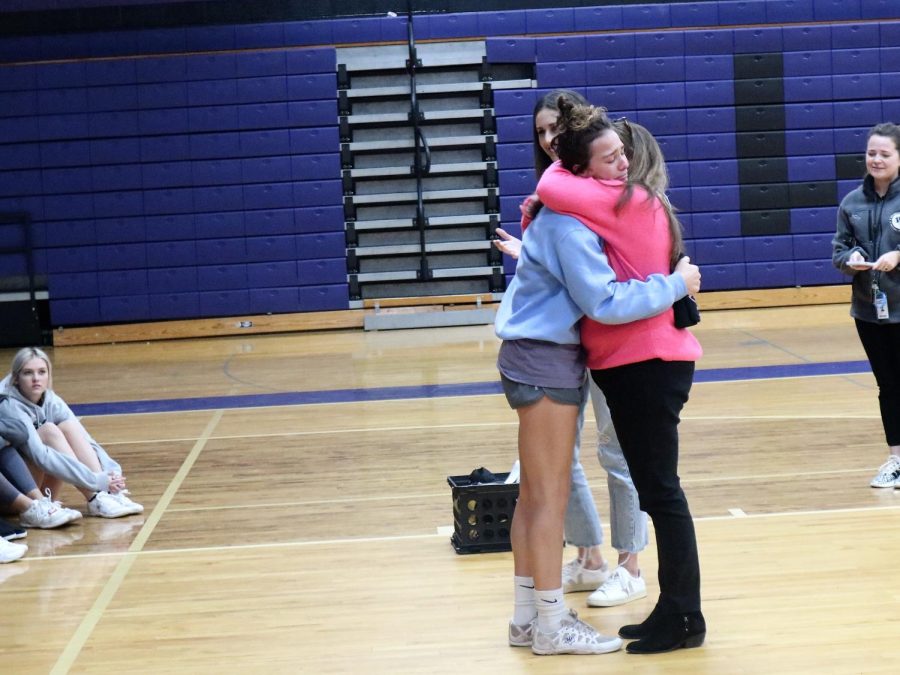 EMOTIONAL ANNOUCEMENT. After hearing her name announced as the $1000 scholarship winner senior Katie Leggett hugs cheer coach Nicole Westmoreland as Ark Church representative Courtney Small looks on.  
